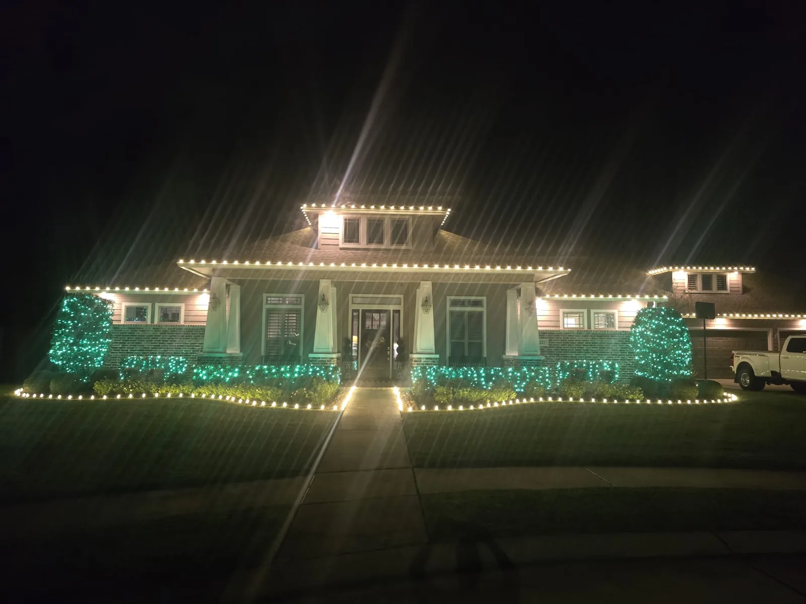 Custom Christmas light display installed on a Houston home by Christmas Lights of Houston